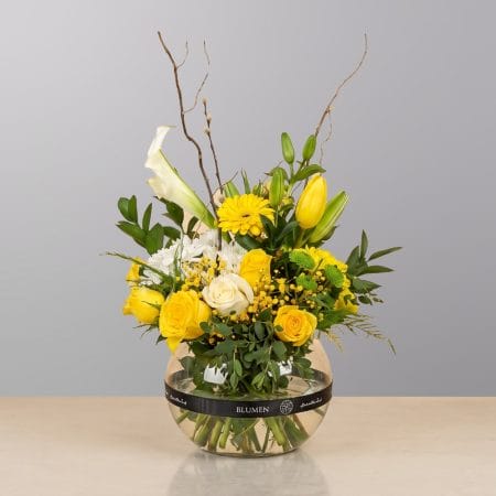 A fresh and elegant floral arrangement featuring premium blooms, delicate seasonal flowers, and lush greenery, beautifully arranged in a decorative vase.