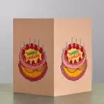 A card holder with the image of a colourful birthday cake.
