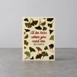 A card holder with a comforting message surrounded by leaves.