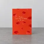 A red card holder with a romantic sentence