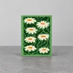 A green card holder with white sunflowers.